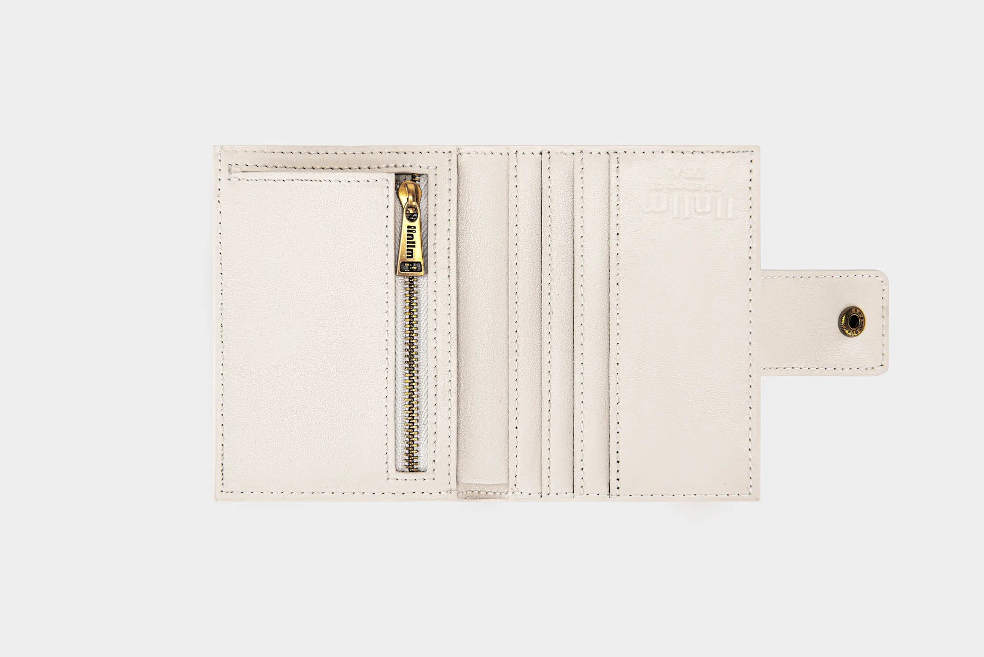 The inside of white llnllm wallet with card slots and gold zipper coin pocket.