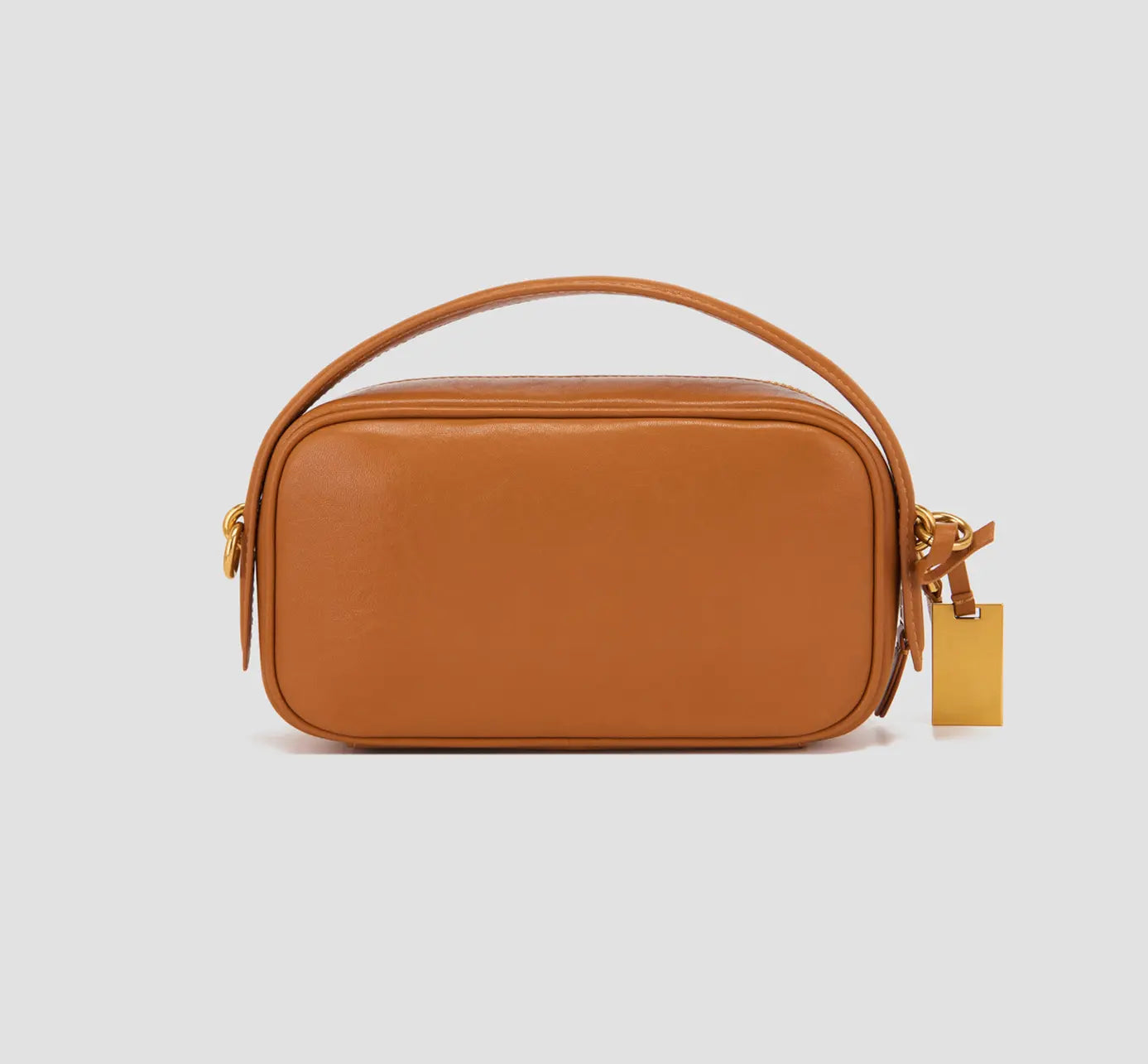 The back view of tan mini shoulder bag – modern leather crossbody with clean silhouette, perfect everyday purse for women.