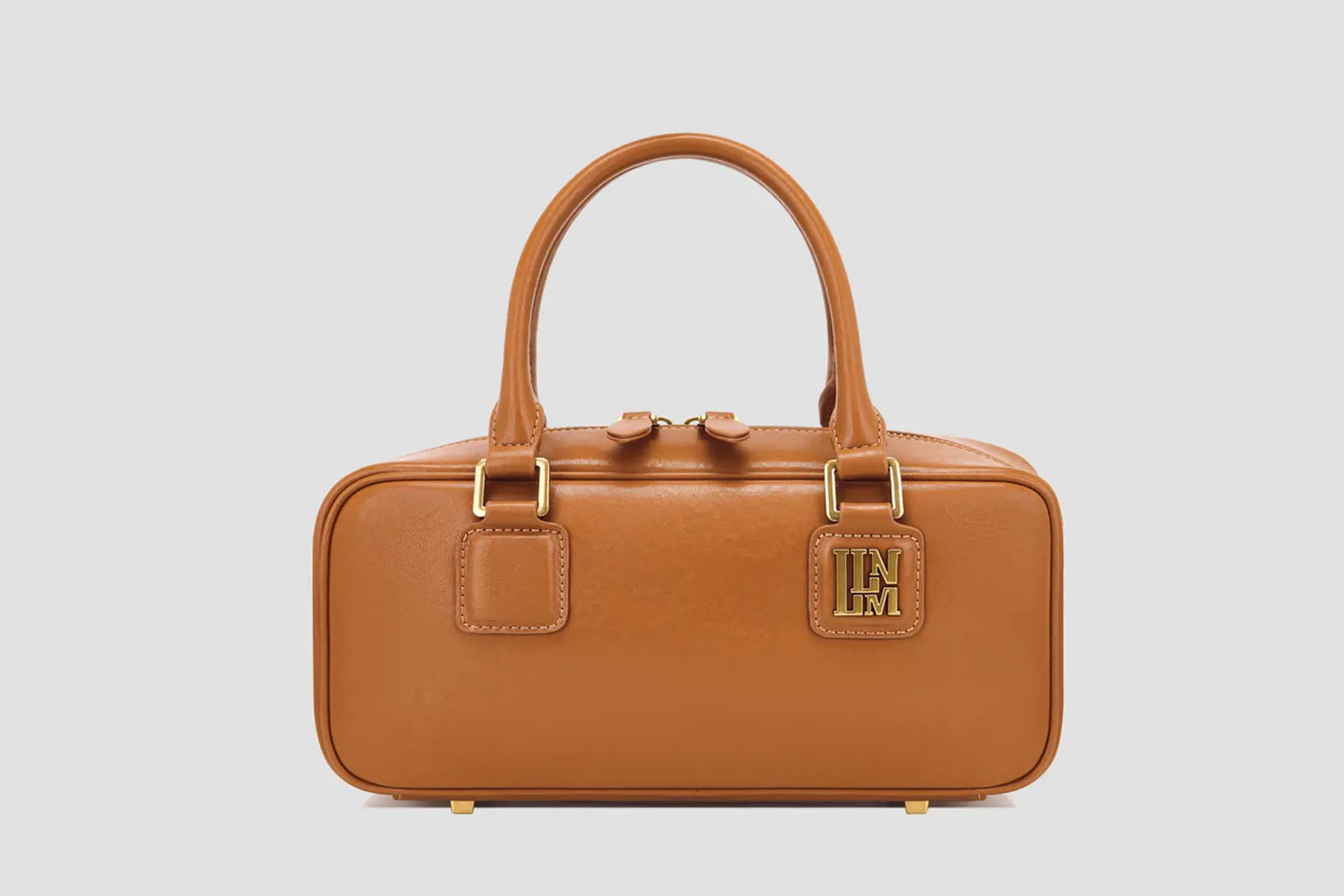 The Front view of the designer inspired a brown top-handle bag with a structured design.