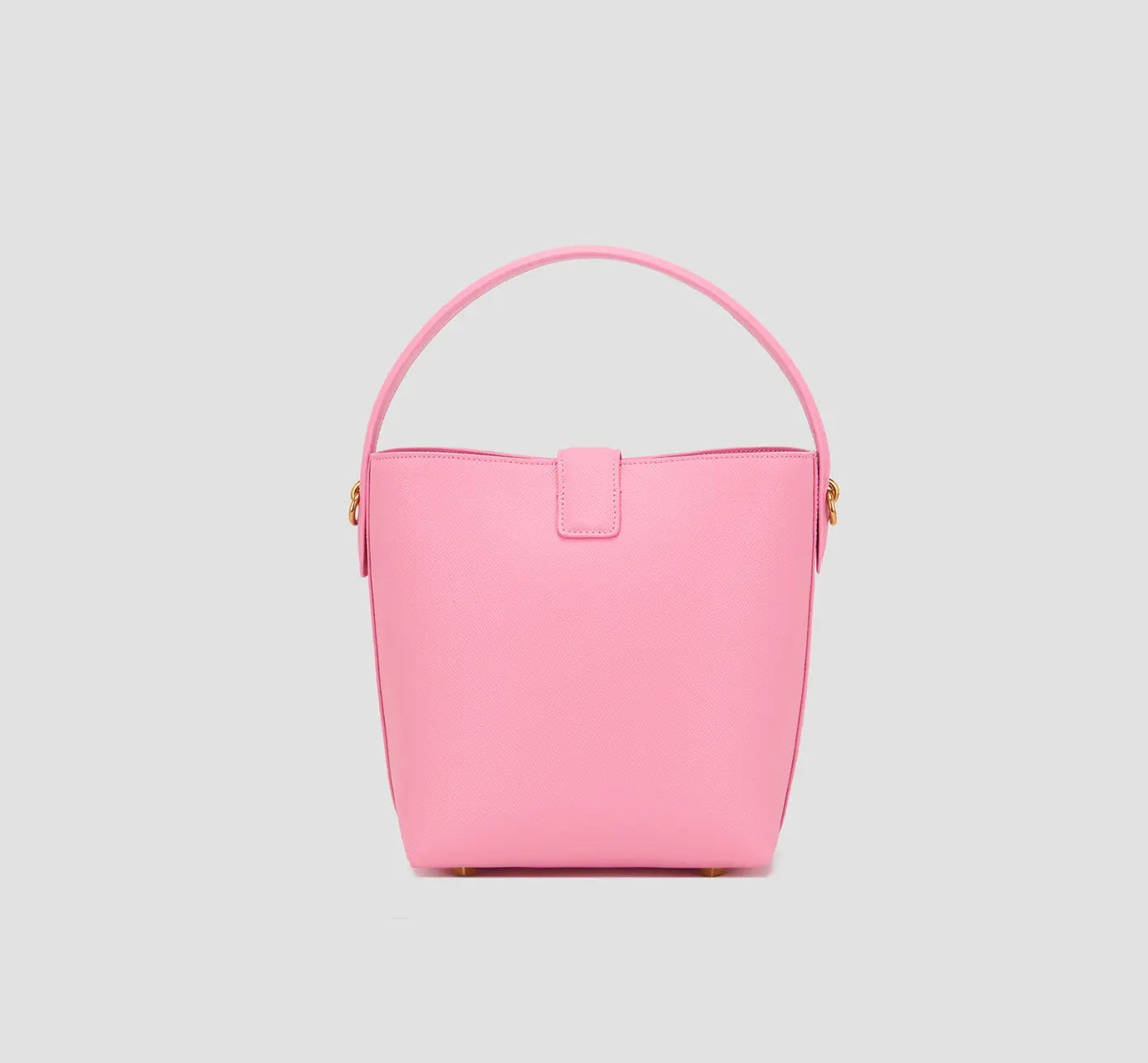 The back side of elegant pink vegan leather bucket handbag with smooth finish and clean stitching.