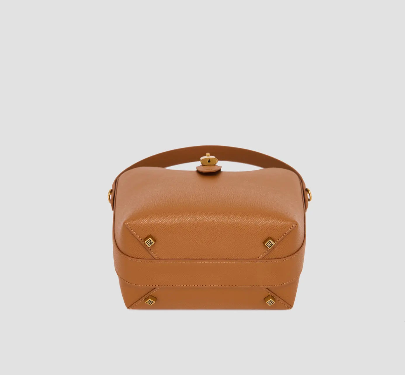 The bottom of brown handbag base with protective gold feet – llnllm structured bucket bag for durable daily use.