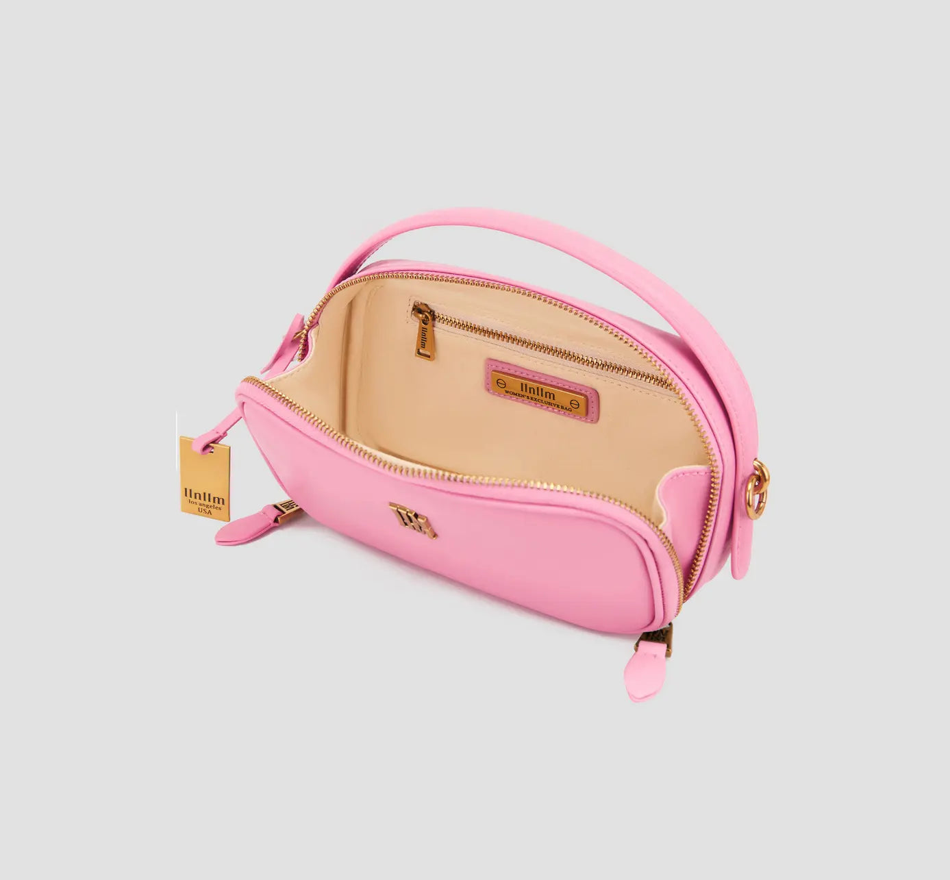 The open pink crossbody purse with beige interior – trendy small handbag with inner zip pocket for essentials.