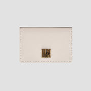 Front view of white  wallet with gold logo detail.