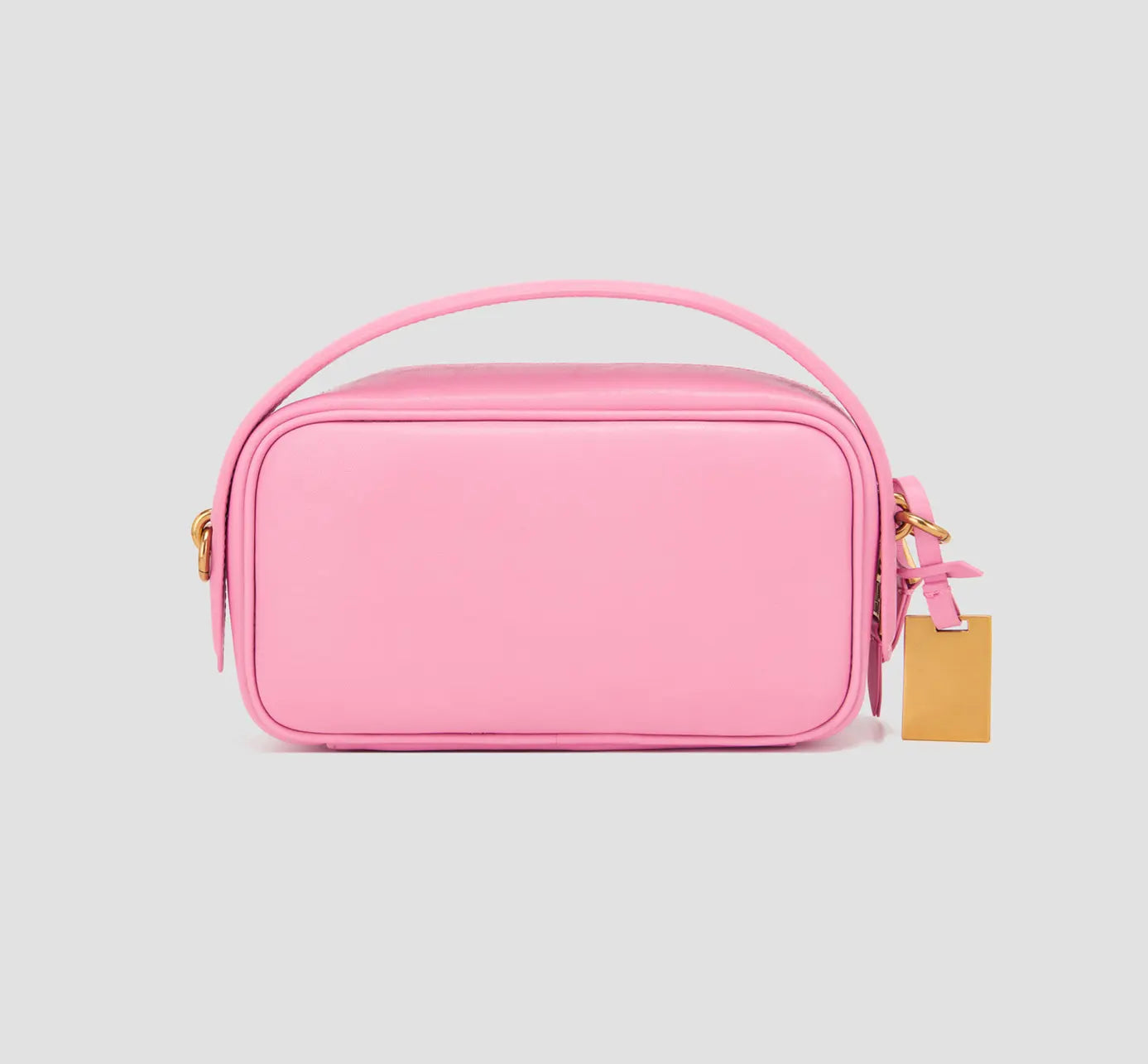 the back view of minimalist pink handbag with plain back and top handle – modern crossbody design for women’s fashion.