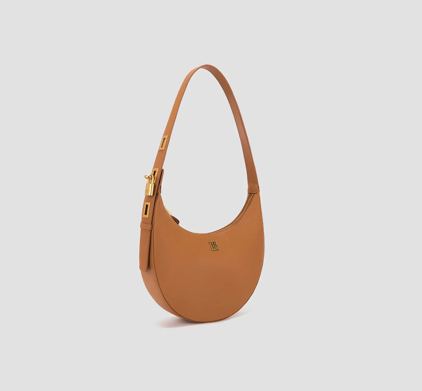 Trendy tan brown half-moon bag with structured top handle and gold hardware – women's leather shoulder handbag.