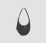 This is an angled view of the Modern black crescent shoulder bag for women with gold accents. It is a vegan leather handbag with a luxury llnllm logo detail.