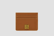 Tan leather llnllm slim card holder with gold logo, classic style.