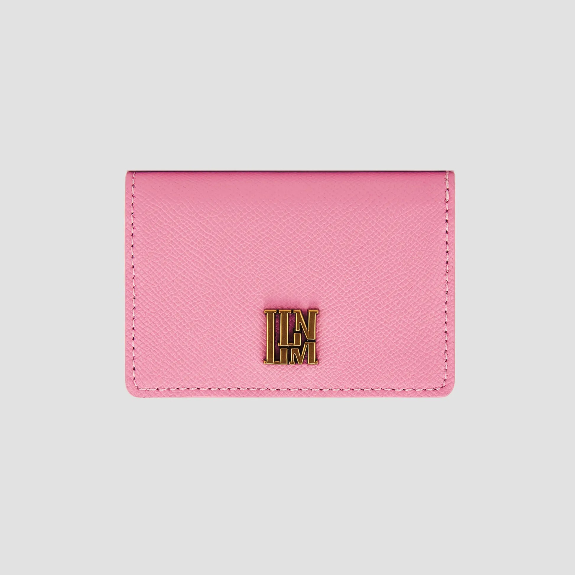 Front view of pink llnllm wallet with gold logo accent.