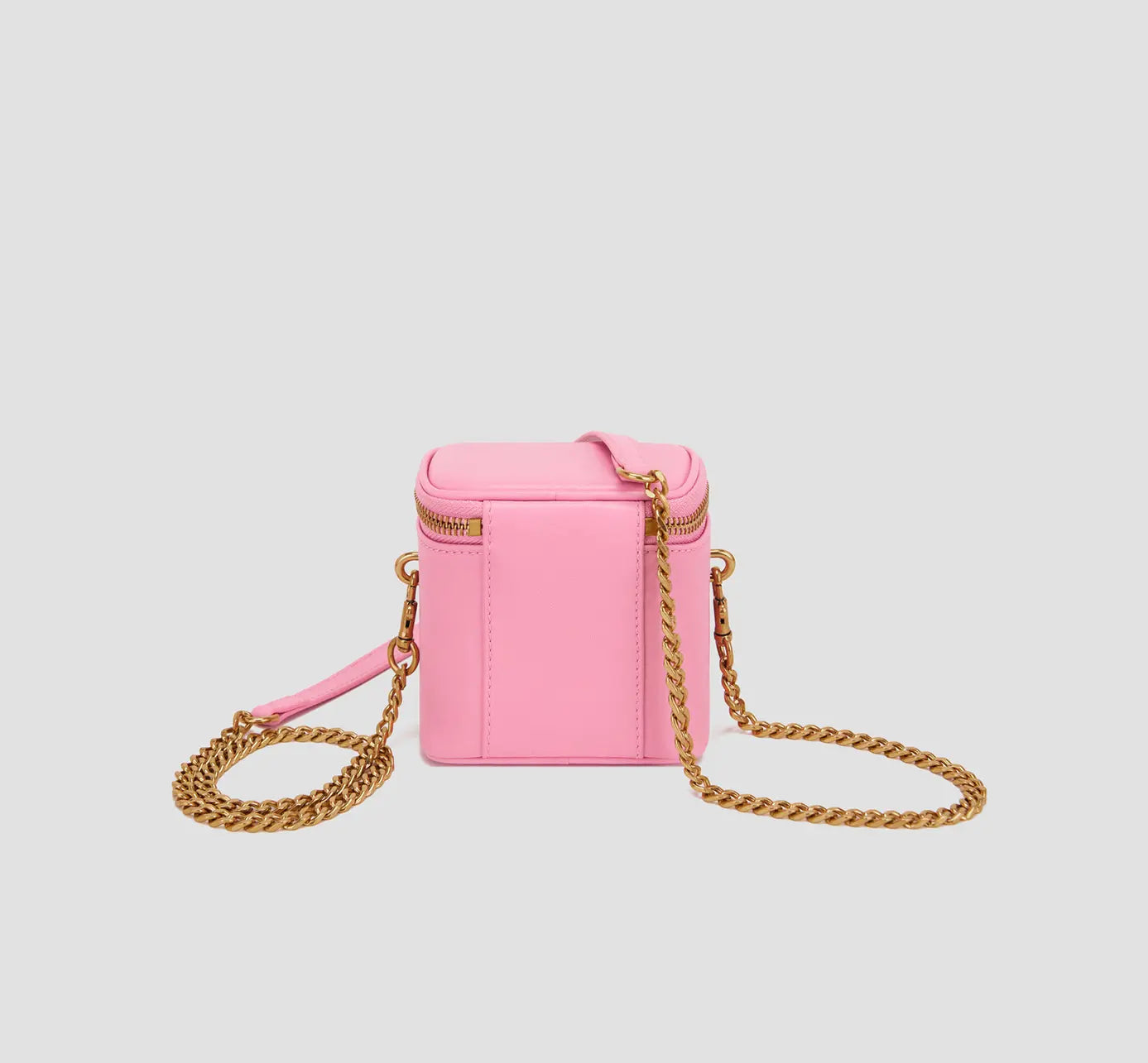 The back view of sleek pink crossbody purse with detachable chain strap, modern mini handbag.