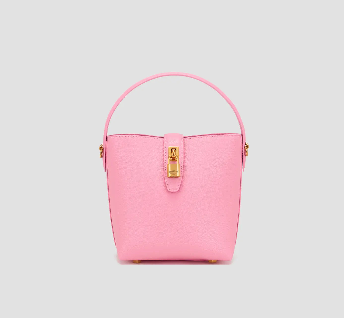 The front view of Pink leather bucket bag for women with gold lock clasp - structured fashion handbag by llnllm.
