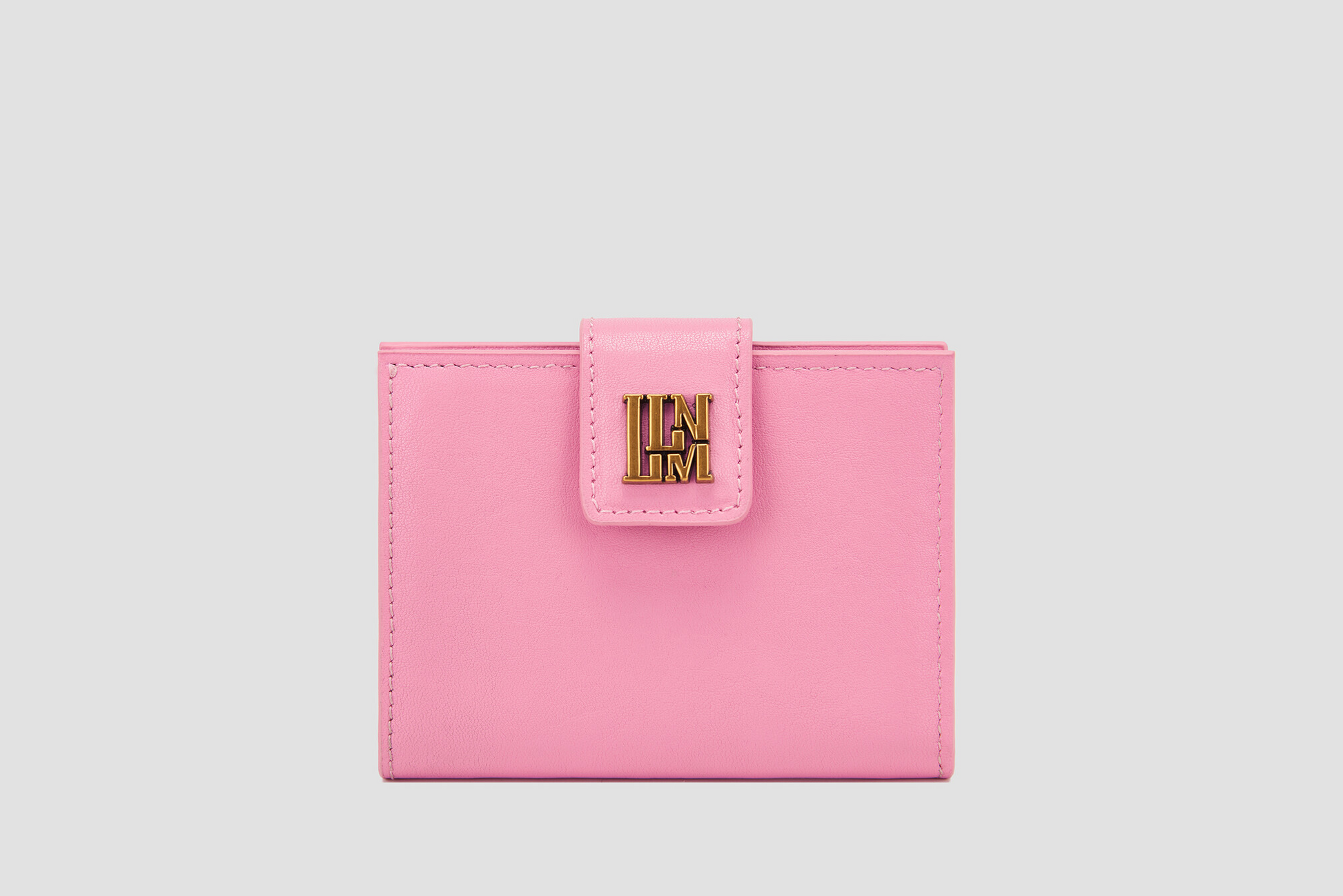 Pink leather llnllm women’s wallet with gold logo clasp, chic and playful design.