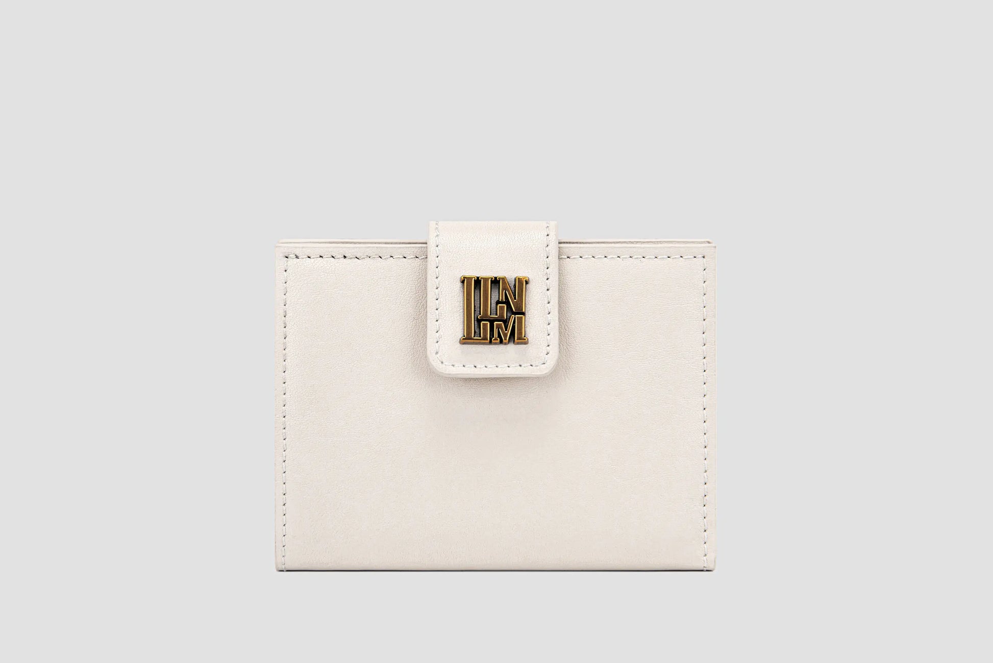 The front of white leather llnllm women’s wallet with gold logo clasp, modern minimalist style.