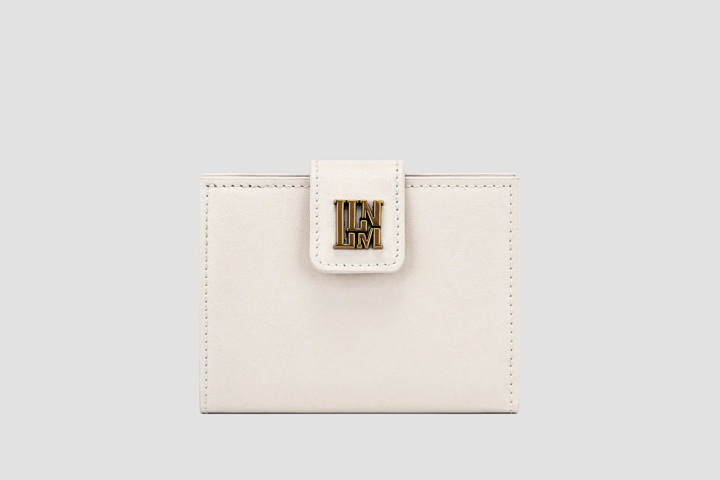The front of white leather llnllm women’s wallet with gold logo clasp, modern minimalist style.