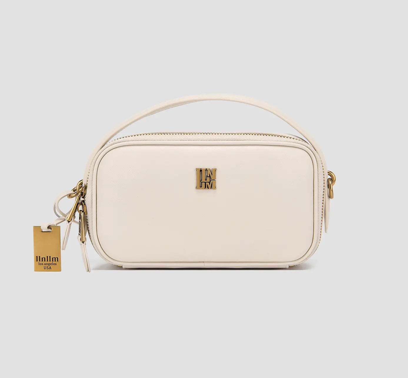 Women’s luxury crossbody handbag with top handle and gold hardware – modern leather mini purse.