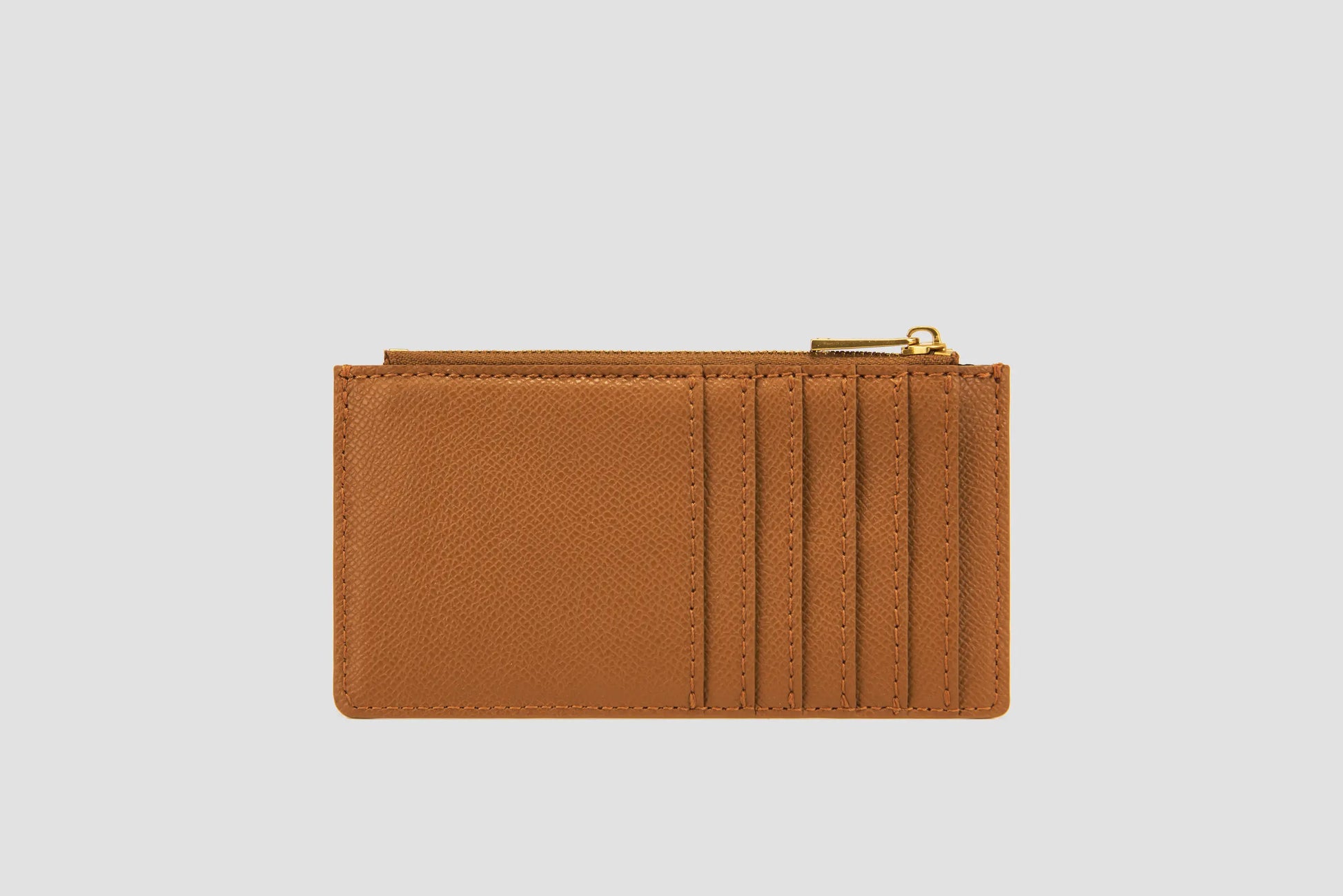 The back view of tan llnllm card holder with mutible card slots.