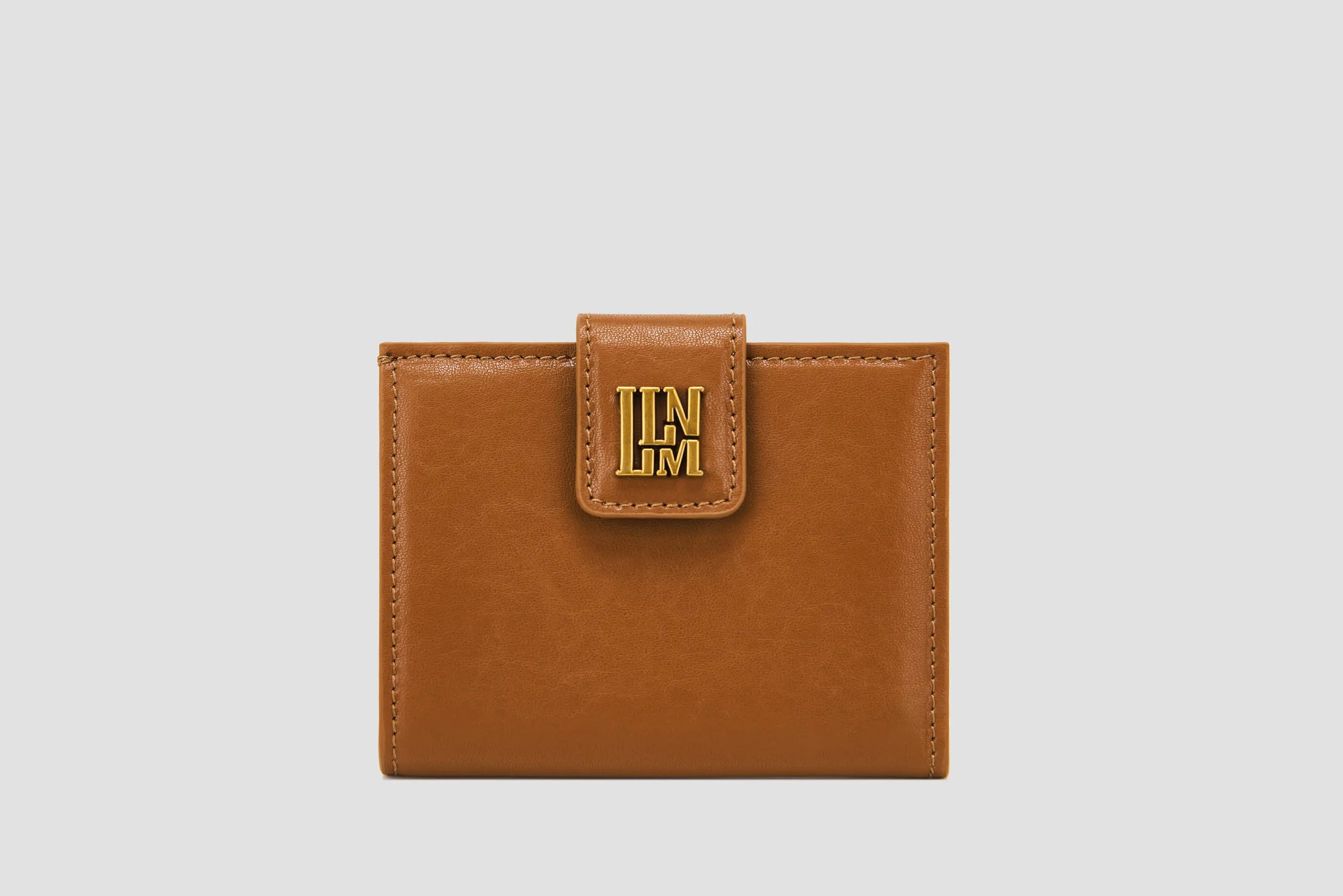 The front of brown leather llnllm women’s wallet with gold logo clasp, classic style.
