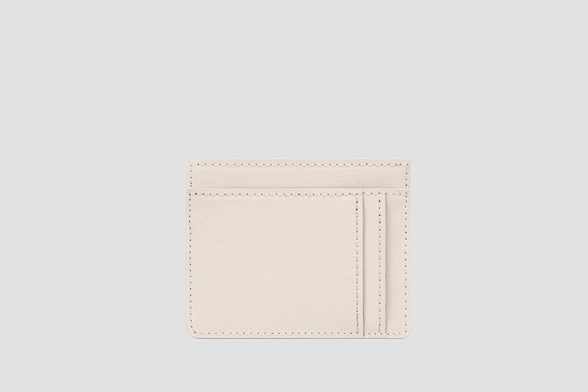The back view of white llnllm card holder with multiple card slots.