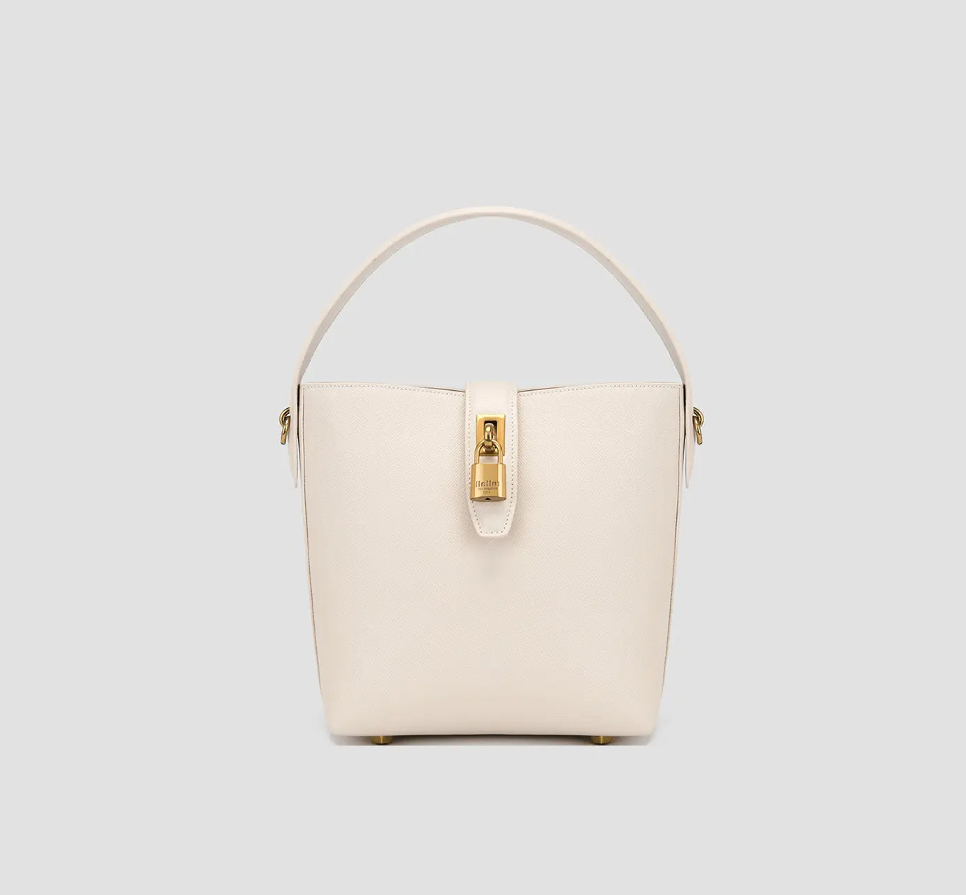 The front view of ivory white bucket bag with gold lock closure – elegant women's structured handbag for office and everyday use.