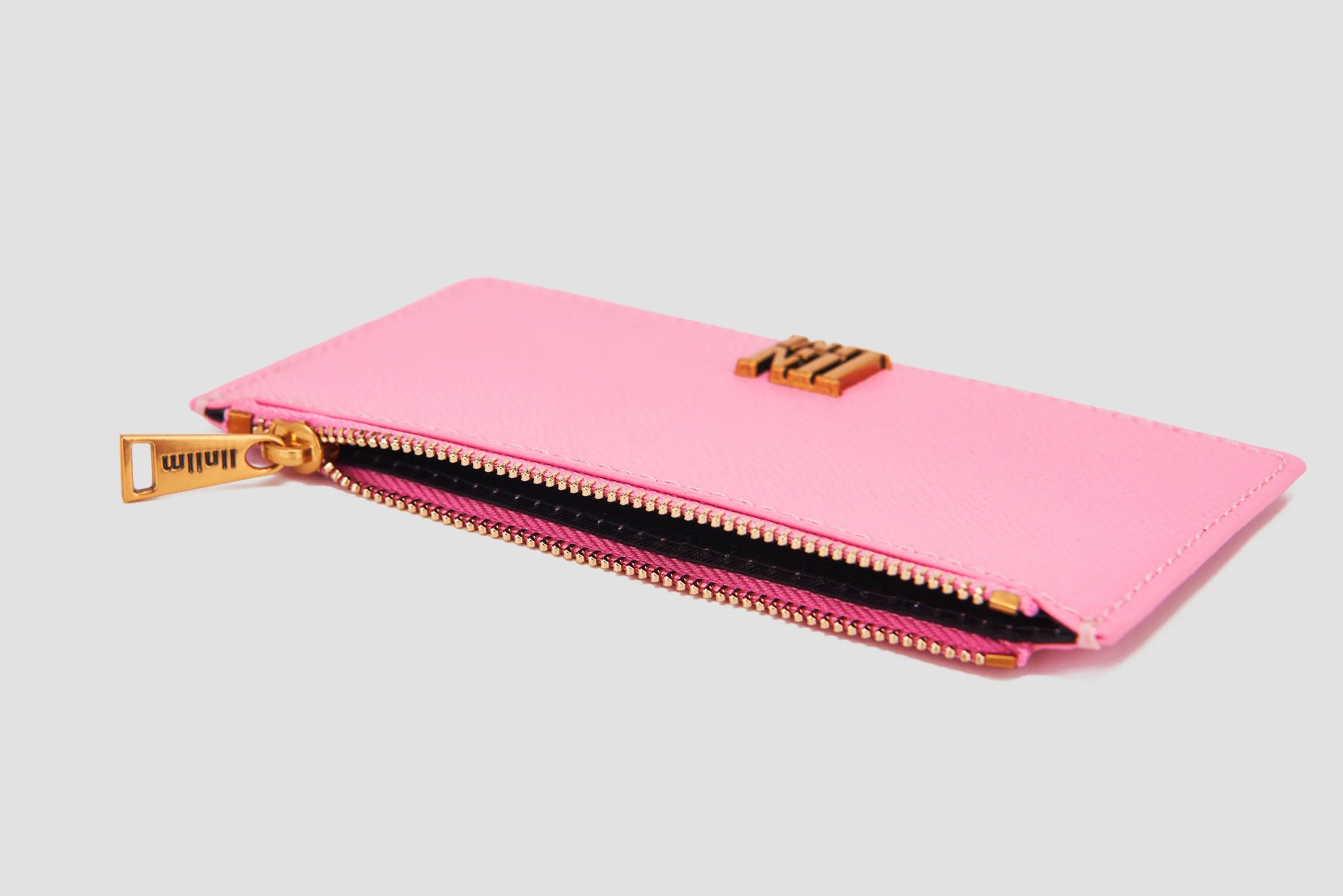 Angled view of pink llnllm card holder with zipper pocket.