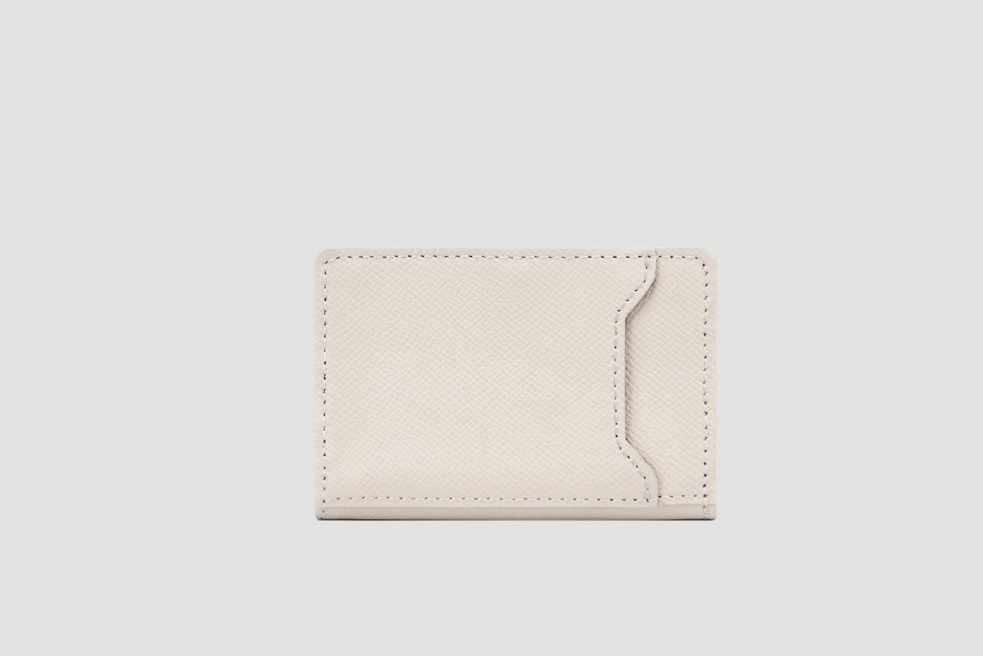 Back view of white wallet with slim pocket design.