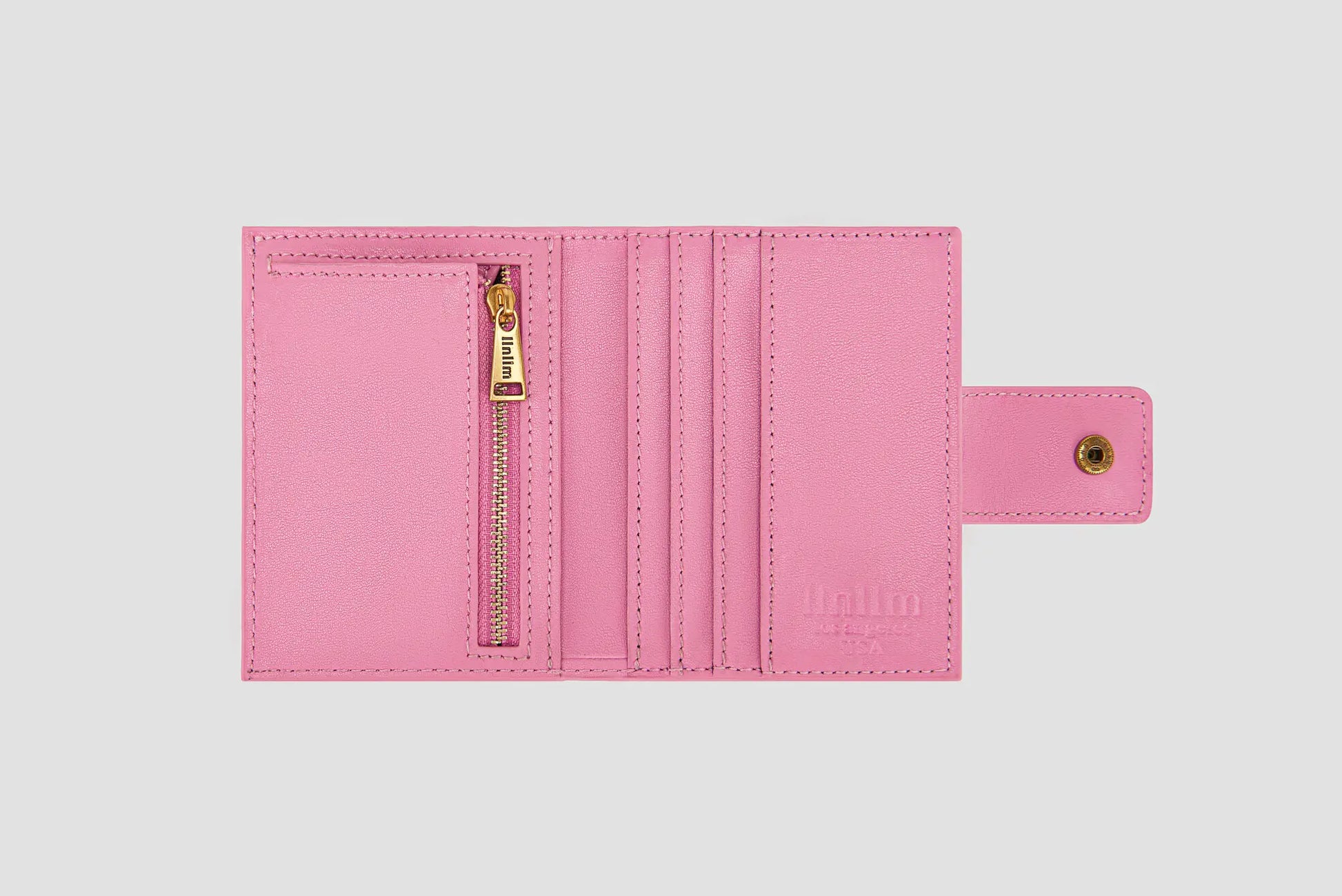 Inside of pink llnllm wallet with card slots and gold zipper pocket.