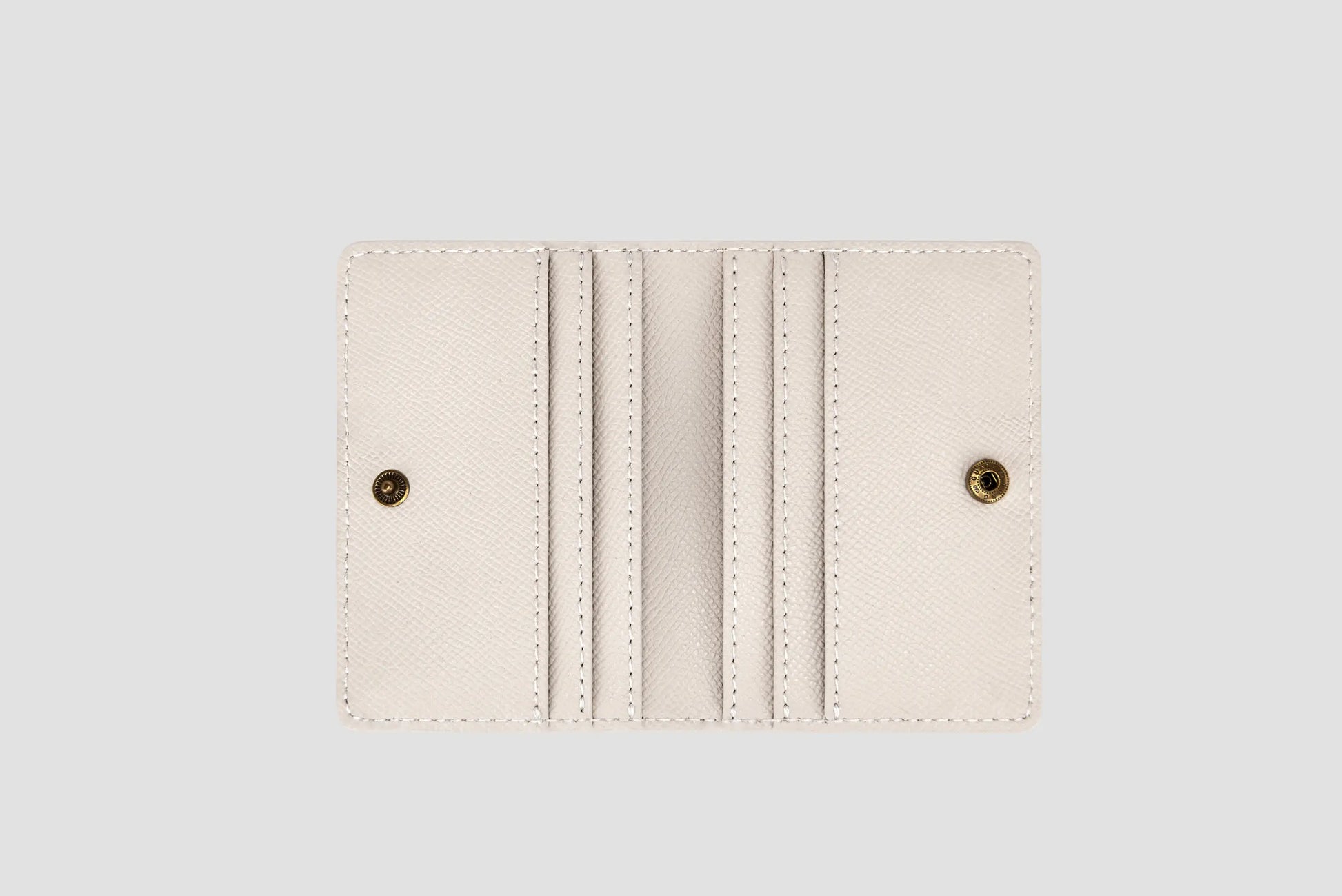 Inside view of white wallet with multiple card slots.