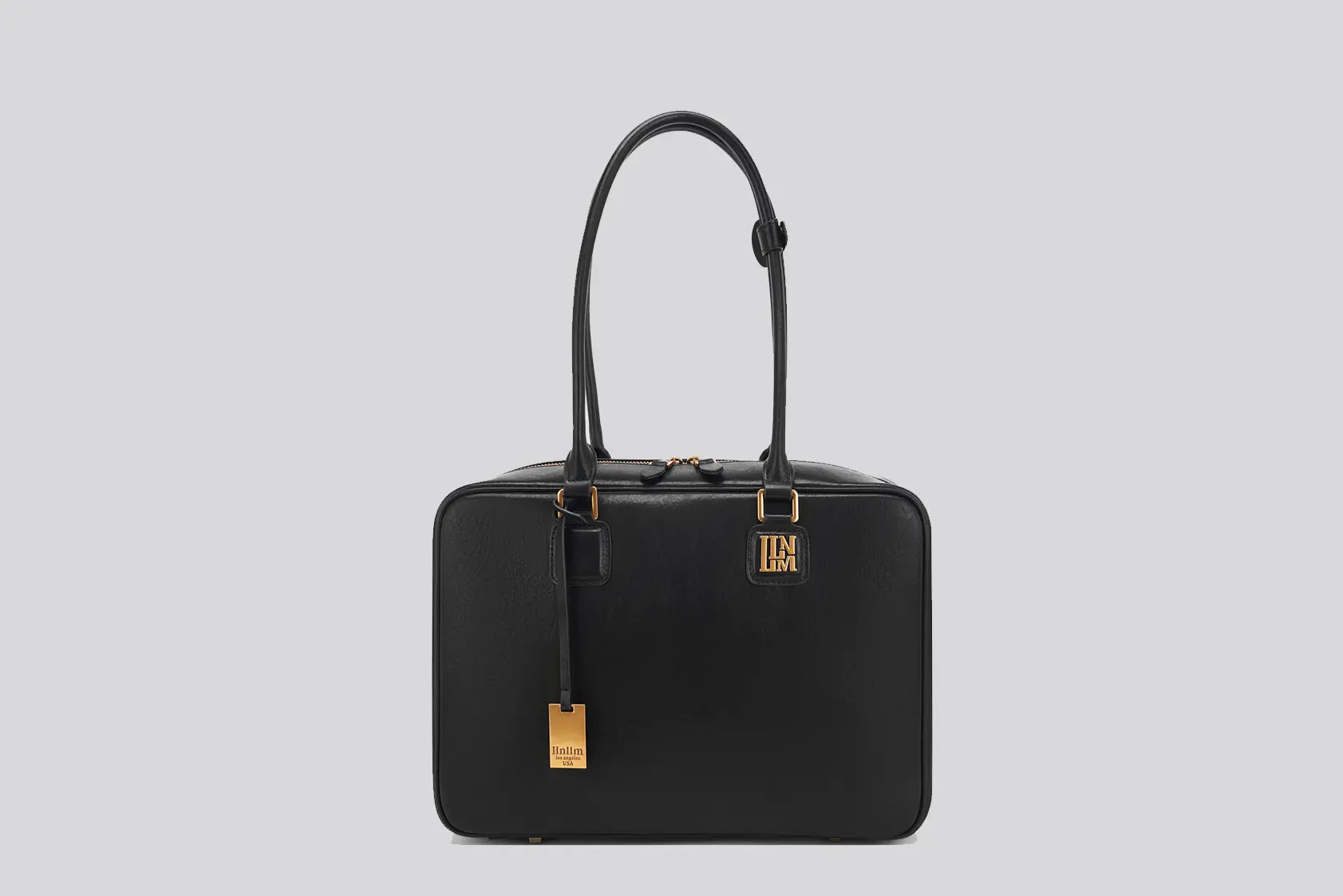 The front View of black leather tote bag for women with gold logo – luxury work handbag by llnllm Los Angeles fashion brand.
